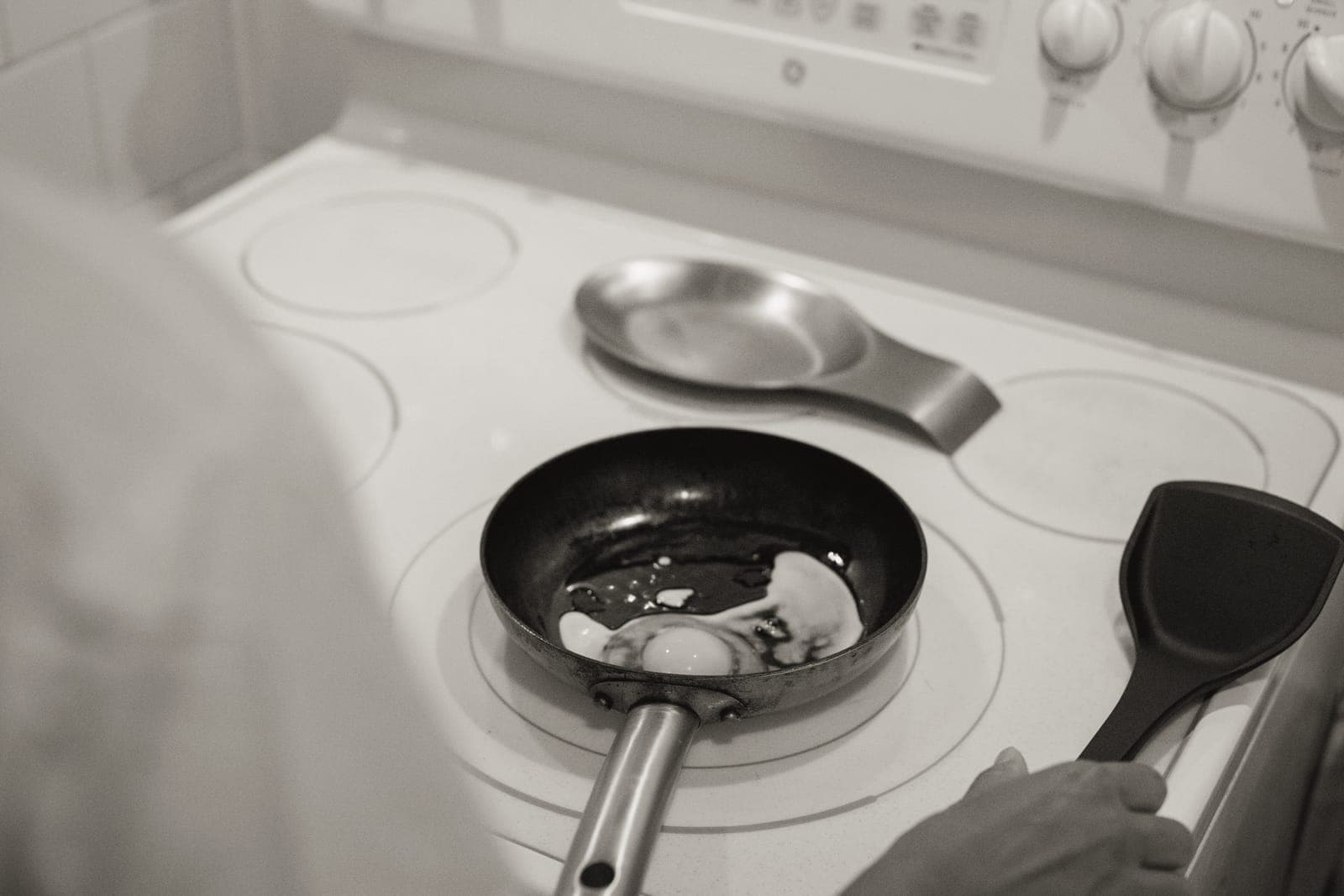 A dark blue steel frying pan on a stove