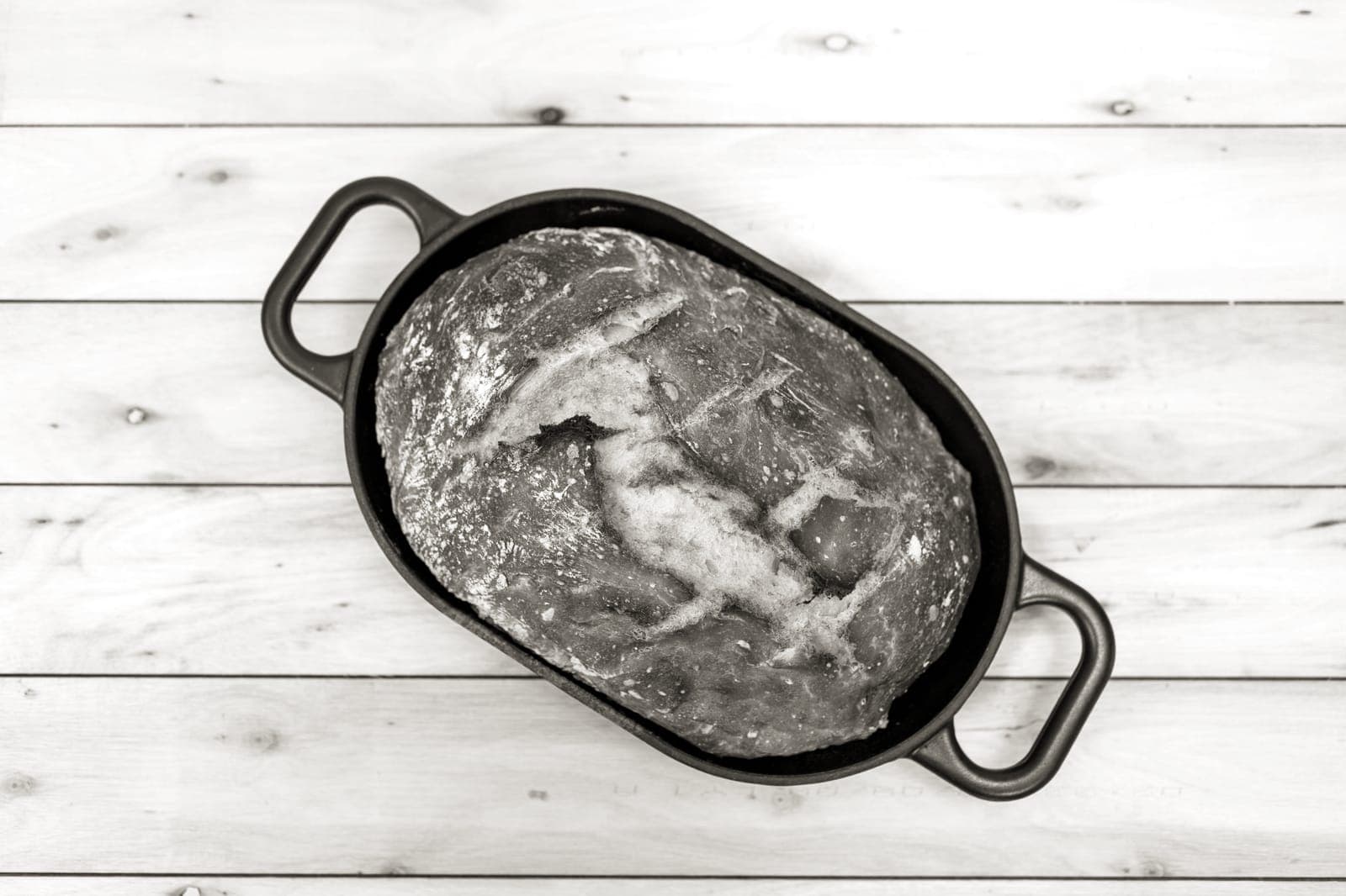 A round loaf of bread baked in a Dutch oven