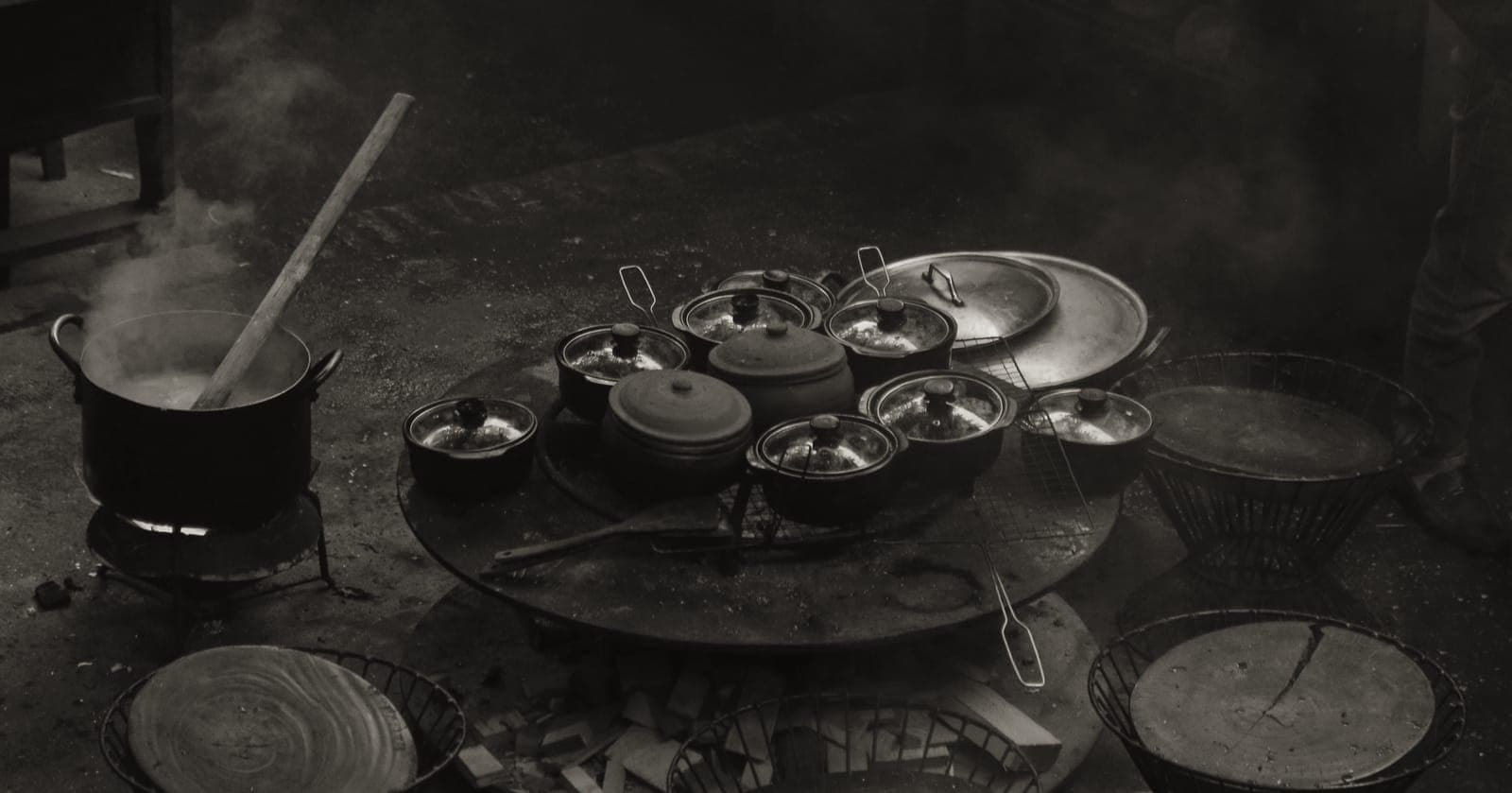 A wide shallow braiser and a deep Dutch oven side by side