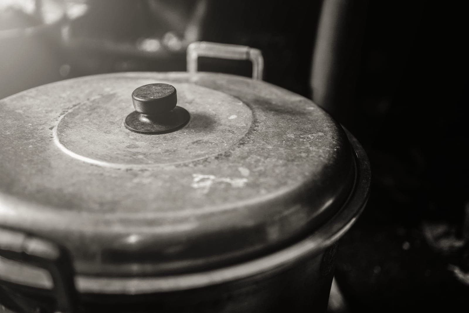 An enameled Dutch oven with the lid off on a stovetop