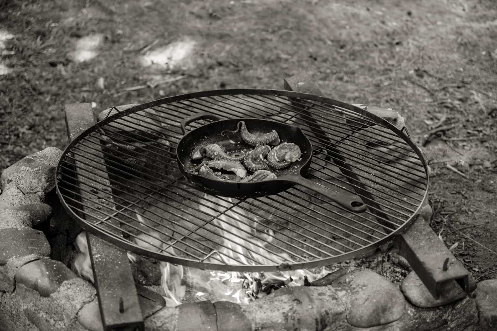 A cast iron skillet on a barbecue grill