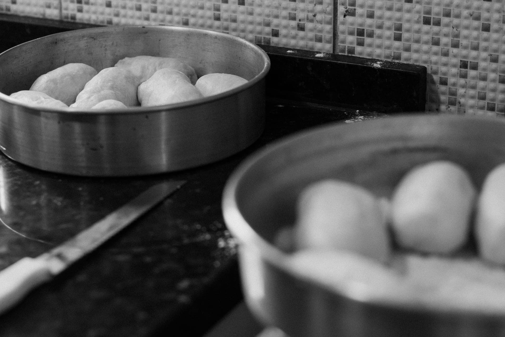 Metal baking trays on a kitchen bench