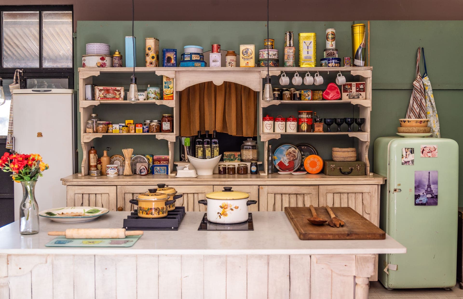 Vintage pans and utensils in an older kitchen
