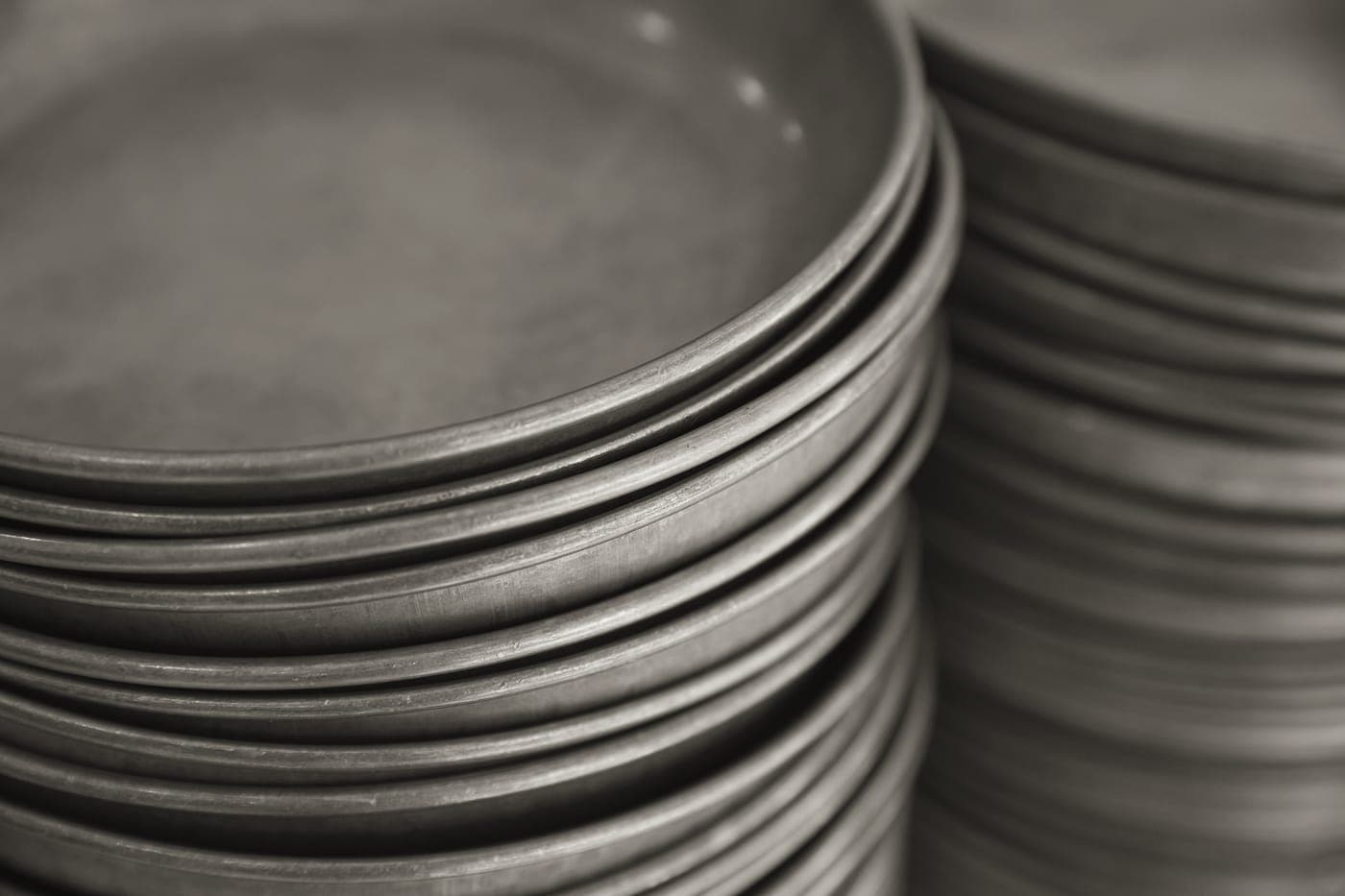 Cookware in several different metals arranged side by side