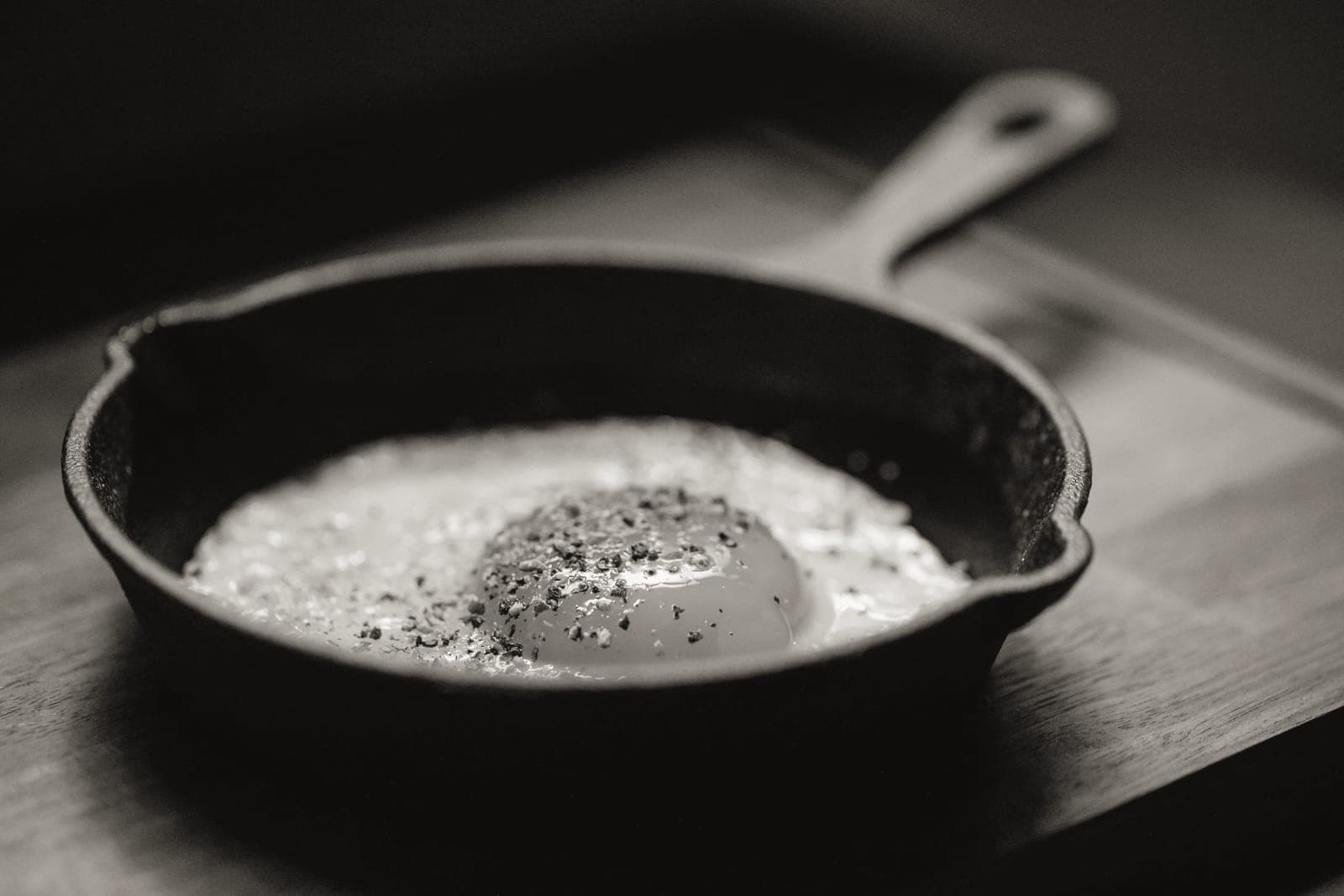 A skillet being placed into a hot oven