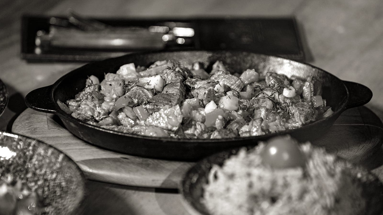 Vegetables being stir fried in a skillet