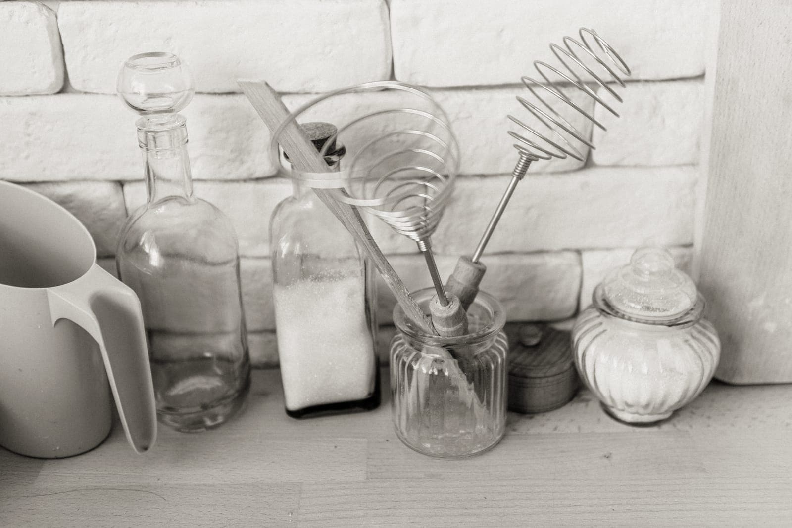 Wooden and silicone kitchen utensils in a jar