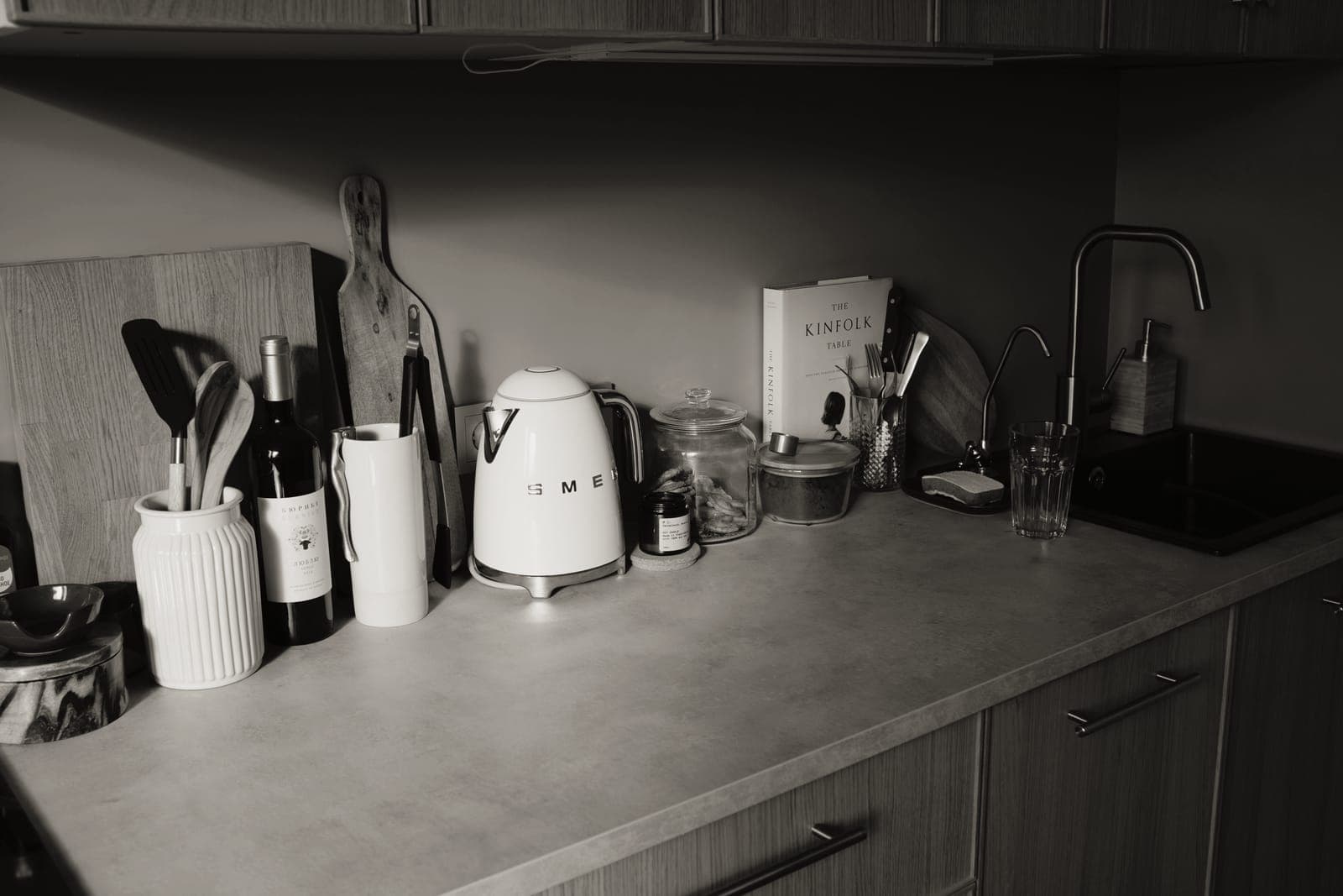 Kitchen utensils and tools laid out on a counter