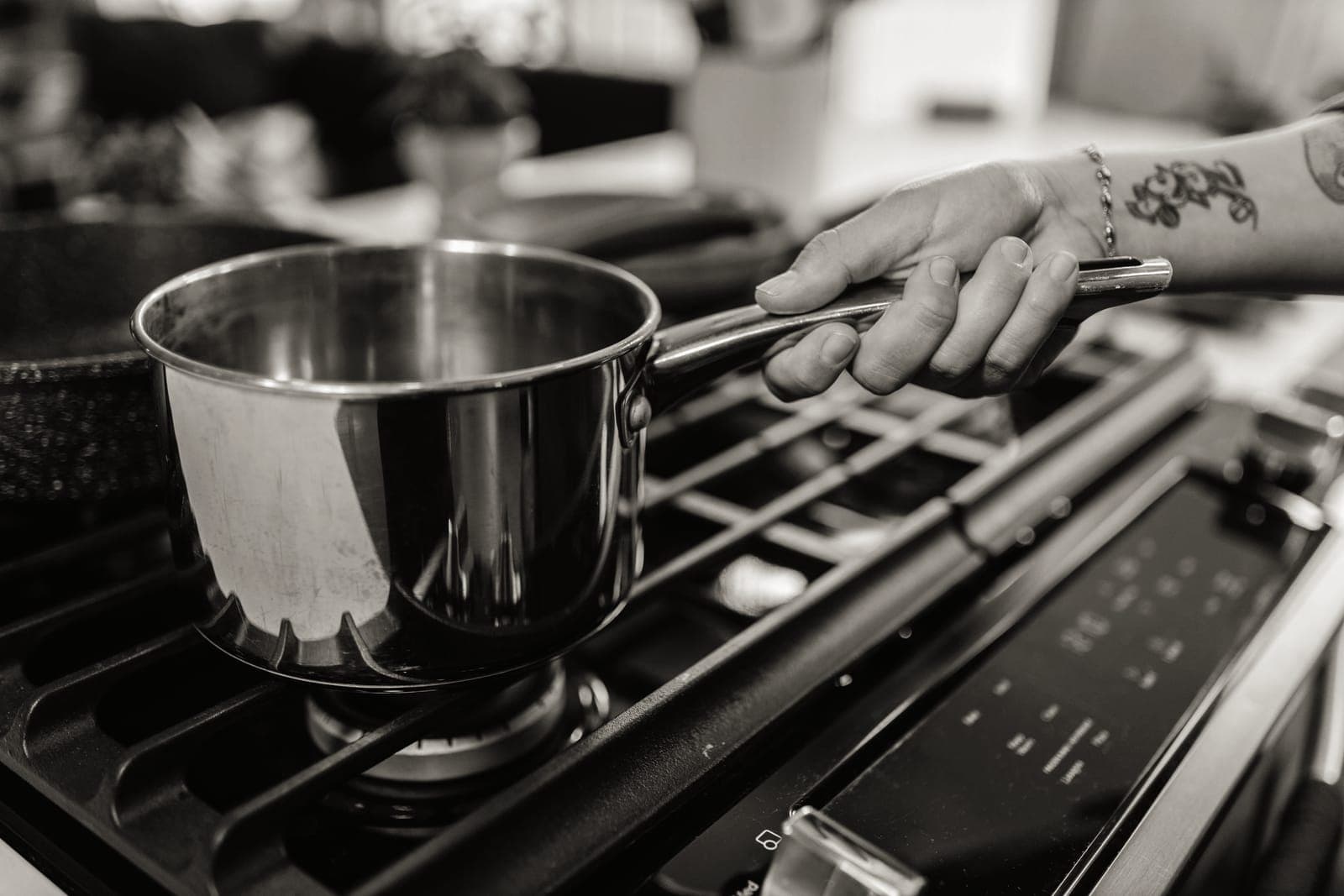A stainless steel saucepan on a stove top