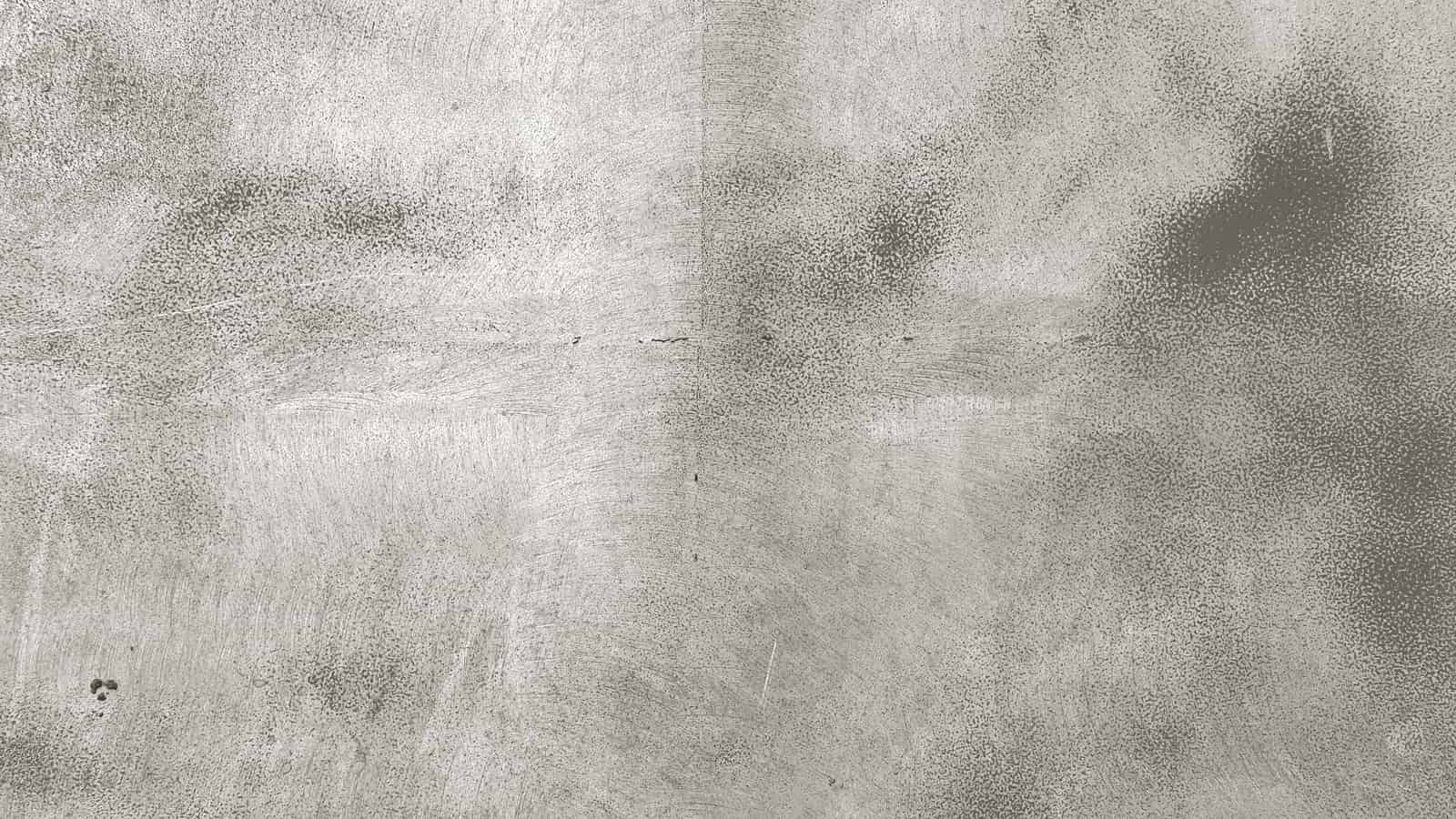 A worn and scratched frying pan surface