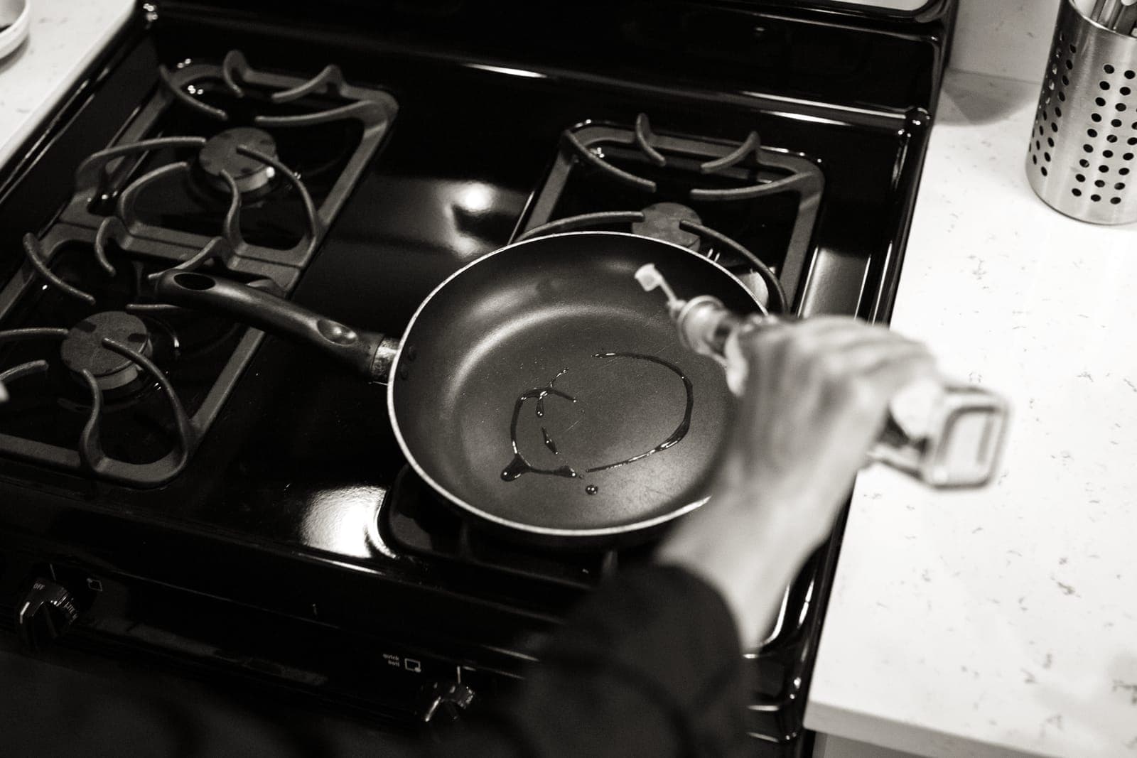 A dark gray nonstick frying pan on a stove