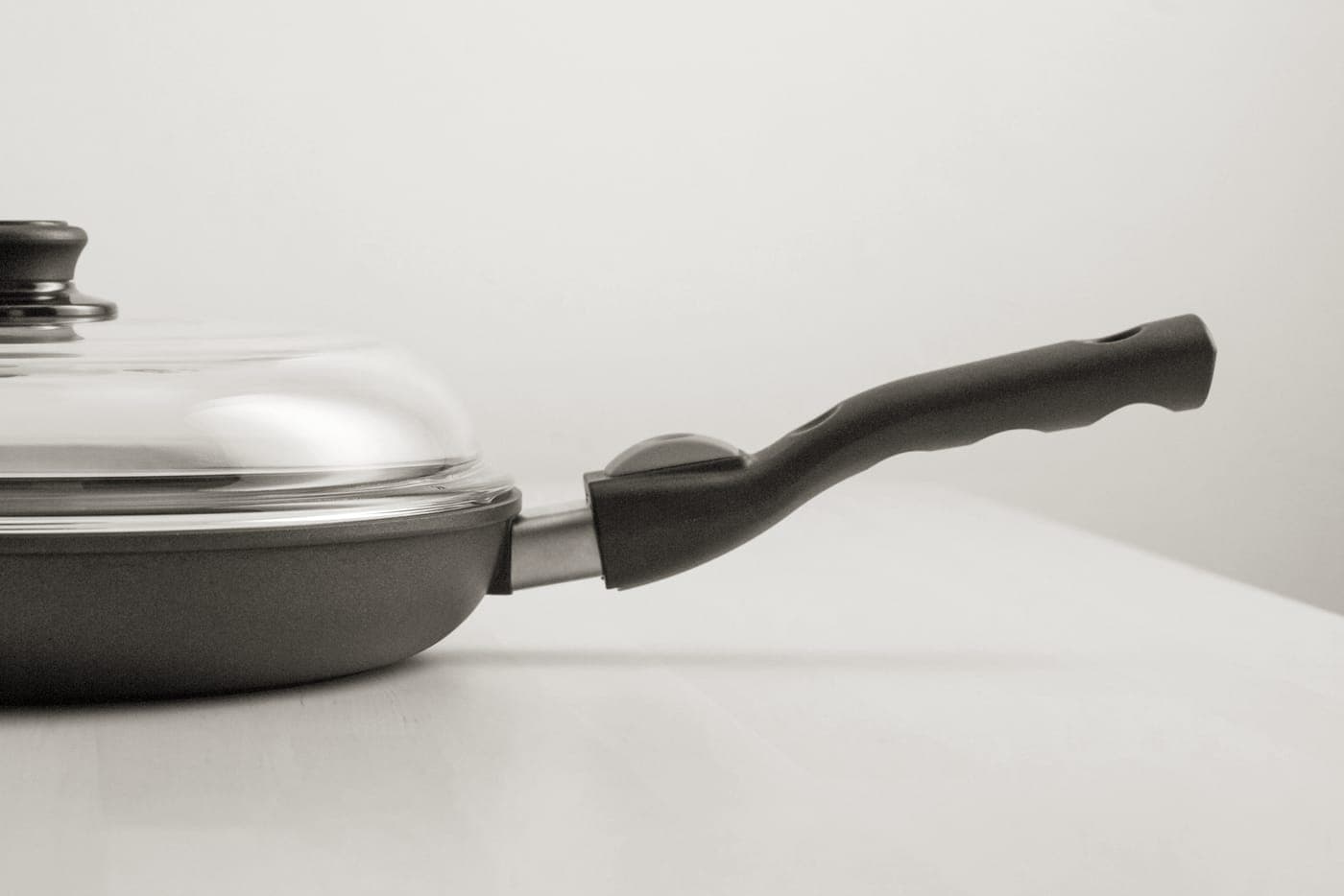 A black nonstick pan on an electric hob