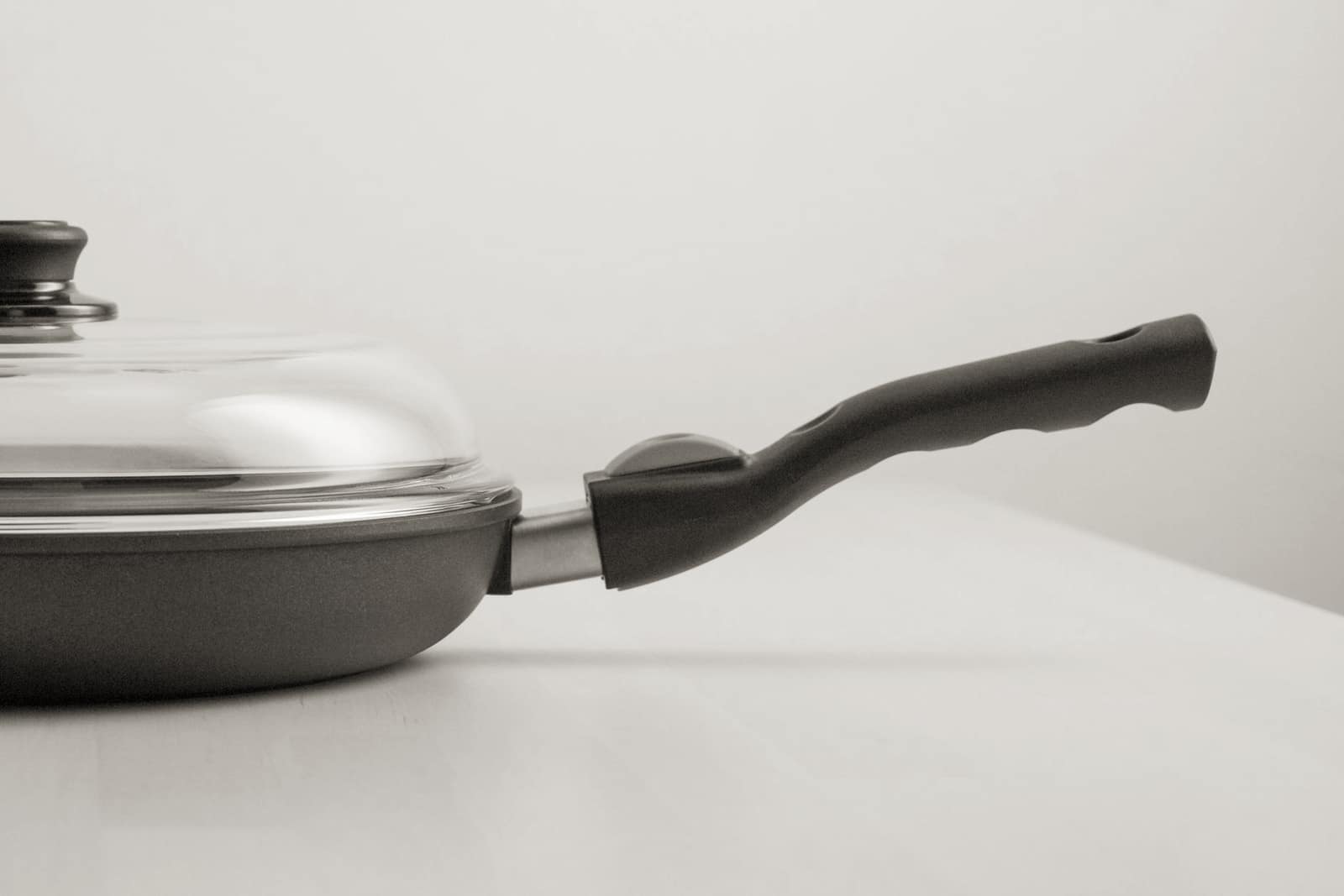 Two frying pans with different nonstick surfaces side by side