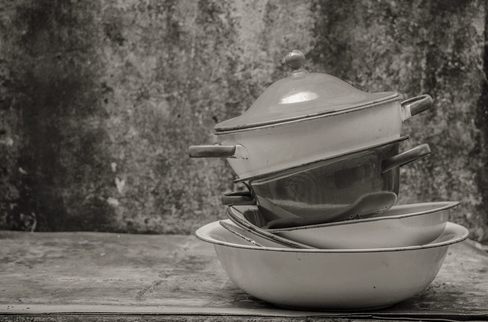 Old frying pans stacked together