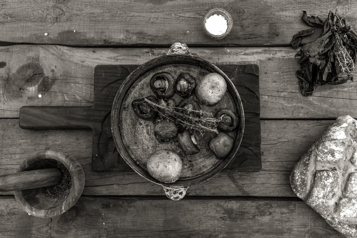 A seasoned cast iron pan on a rustic wooden surface