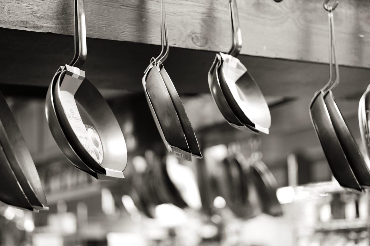 A single frying pan on a clean kitchen counter