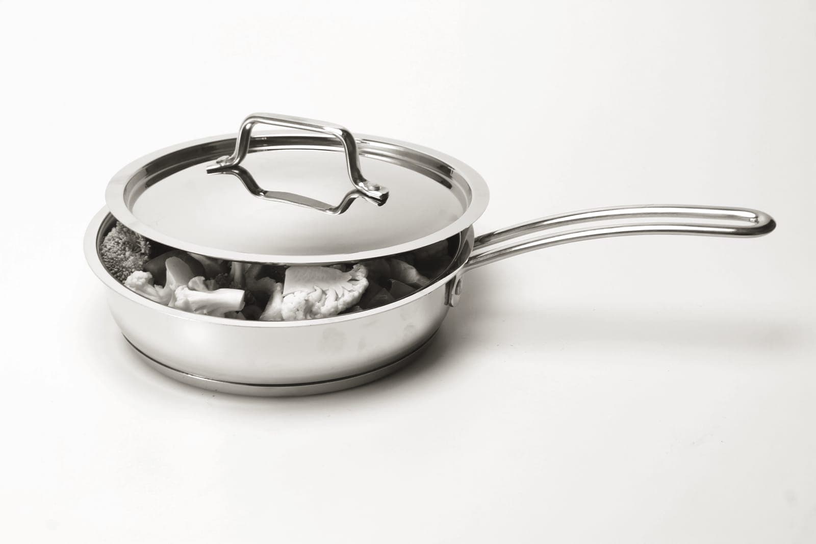 A single stainless steel saucepan on a counter