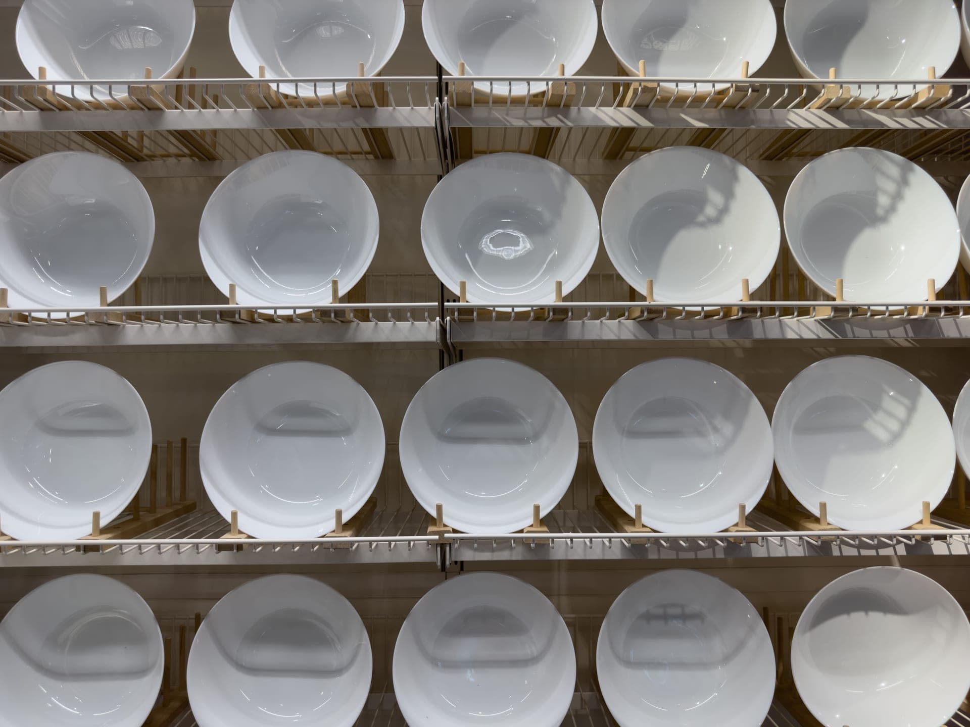 Kitchenware arranged on shelves in a retail store