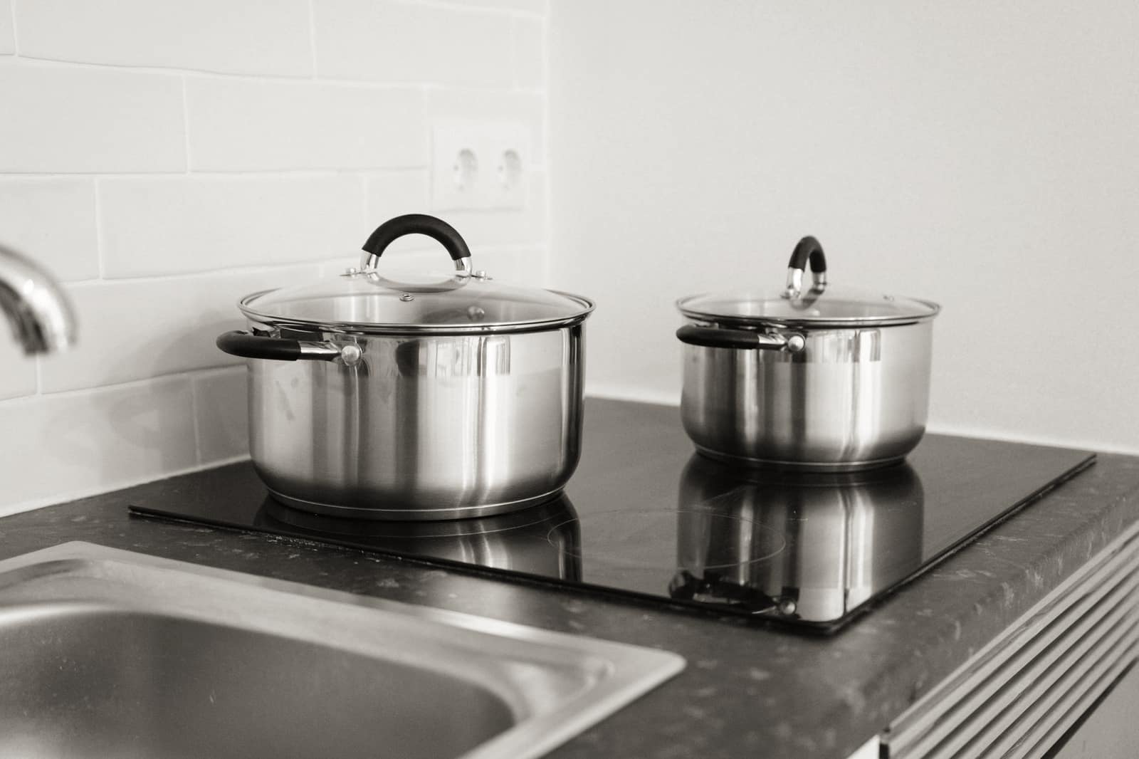 A brushed stainless steel cookware surface in close detail