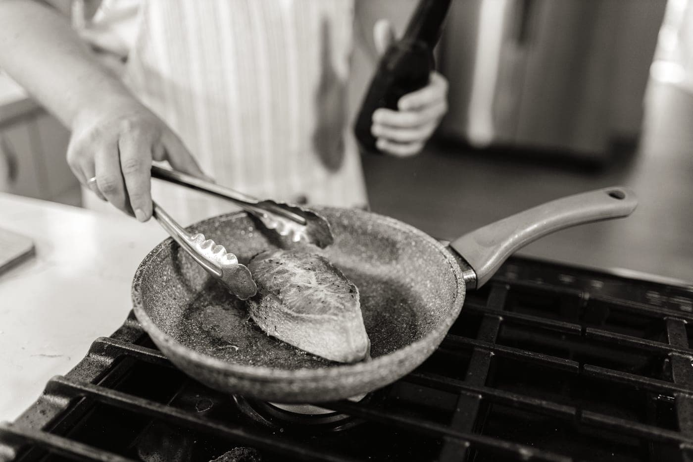 Food beginning to stick in a frying pan